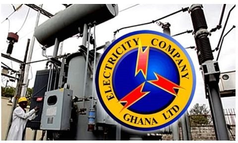 Electrical substation gear with a round Electricity Company Ghana Ltd logo in the foreground.